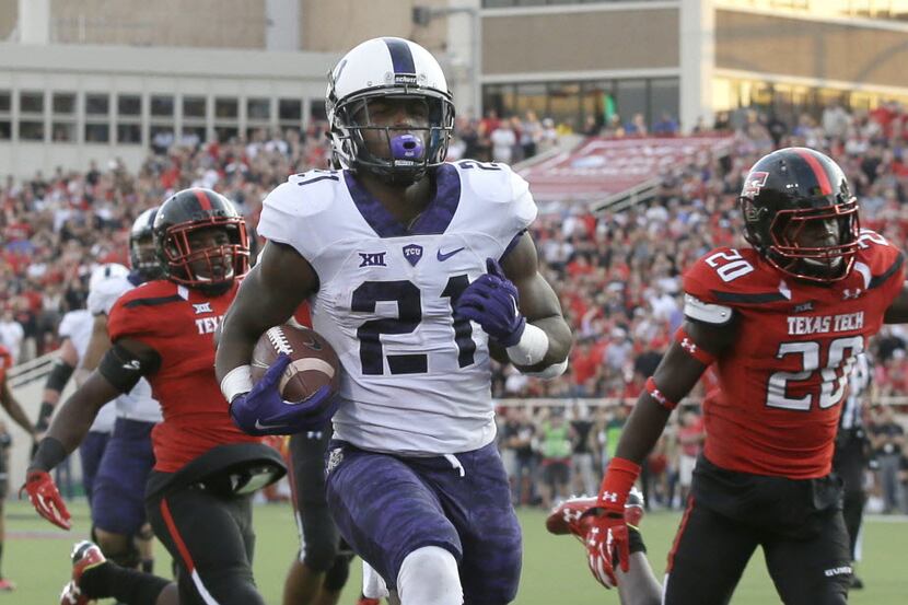 TCU running back DeAndre Washington (21) rushes for a touchdown past Texas Tech defensive...