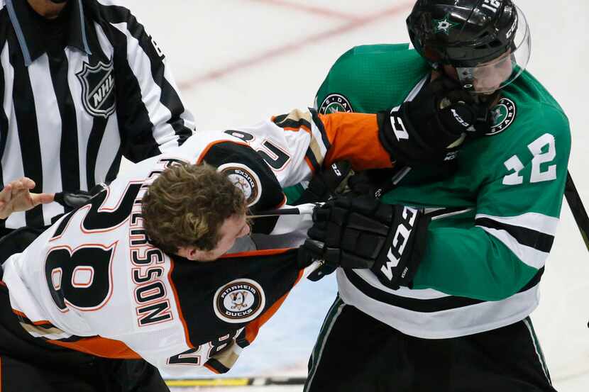 Dallas Stars center Radek Faksa (12) and Anaheim Ducks defenseman Marcus Pettersson (28)...