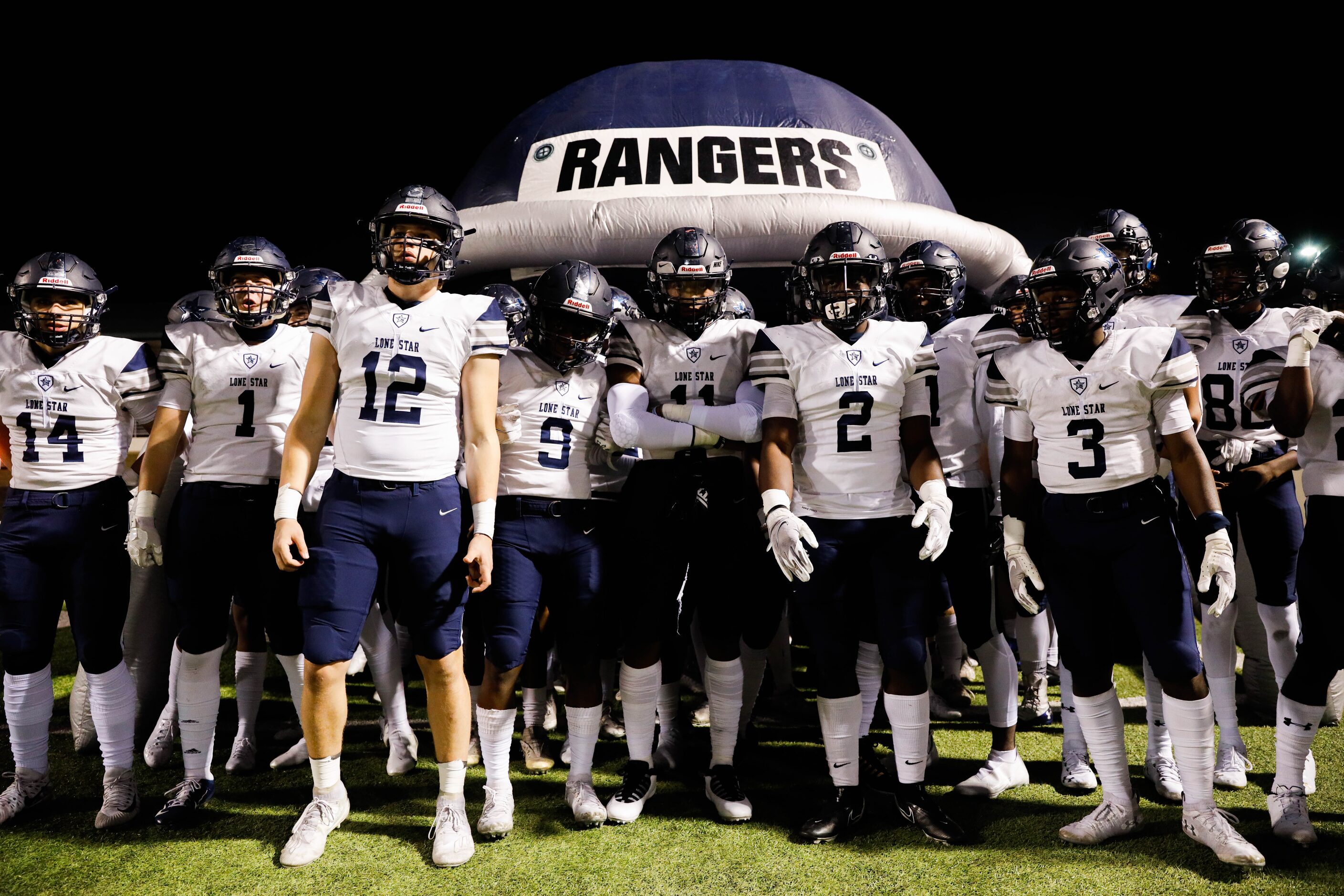 Frisco Lone Star players get ready before the start of a football game against Denton Ryan...