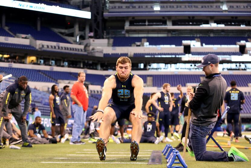 Wisconsin linebacker T.J. Watt competes in the broad jump at the 2017 NFL football scouting...