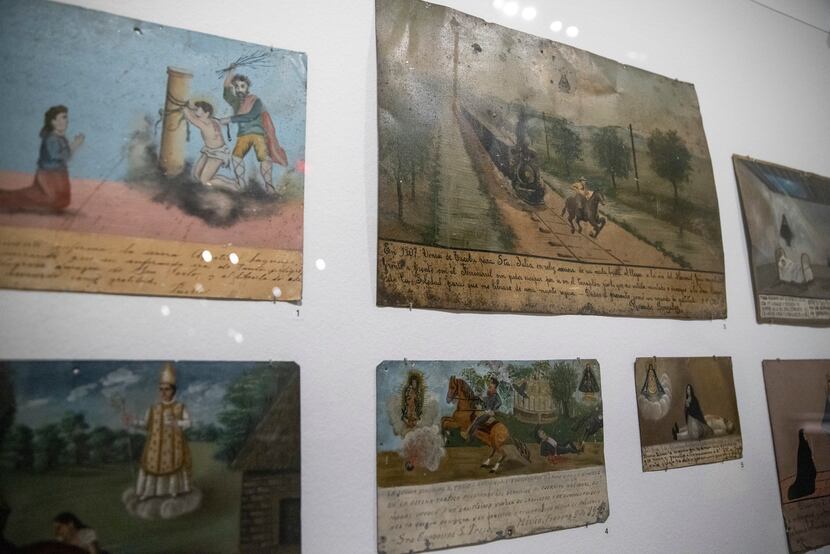 A number of ex-voto paintings, made and offered in gratitude for an answered prayer, are on...