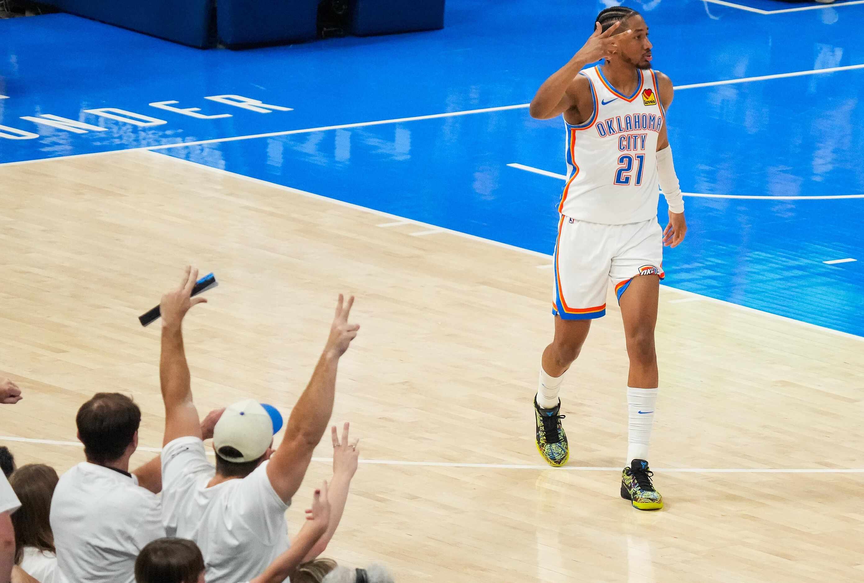 Oklahoma City Thunder guard Aaron Wiggins (21) celebrates a 3-pointer during the first half...