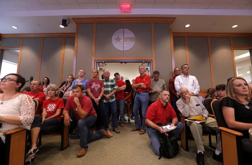 Local landowners crowd the room and hallway to oppose a possible annexation during a council...