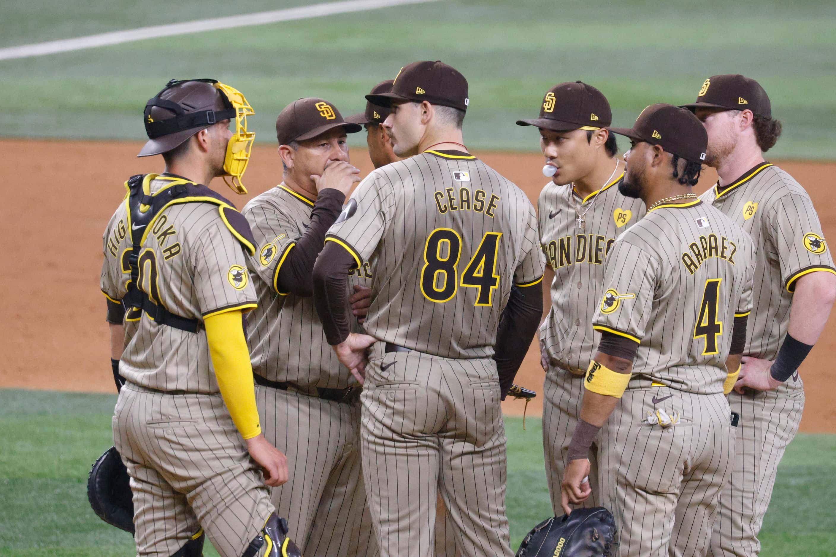 San Diego Padres pitcher Dylan Cease (84) talks with his teammates during the third inning...