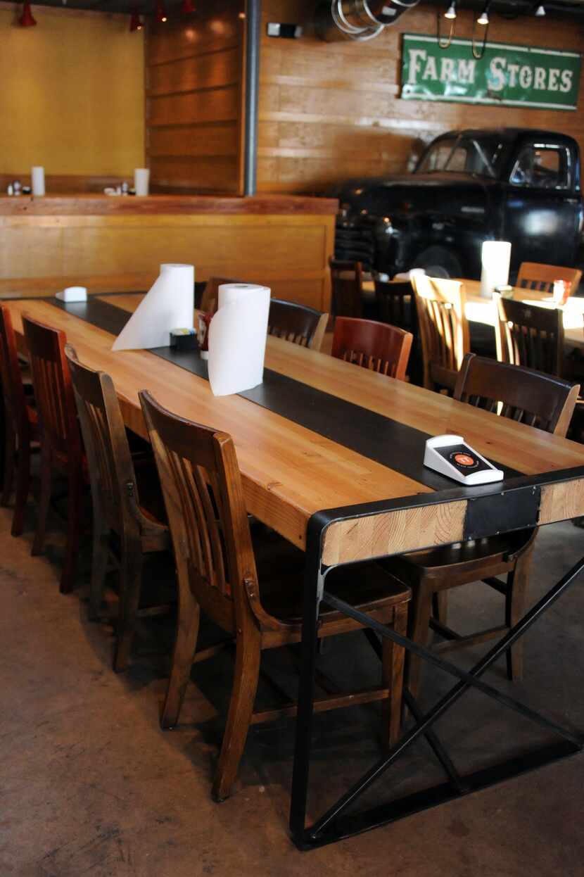 The tables are made from recycled materials at the new Ten 50 BBQ in Richardson.