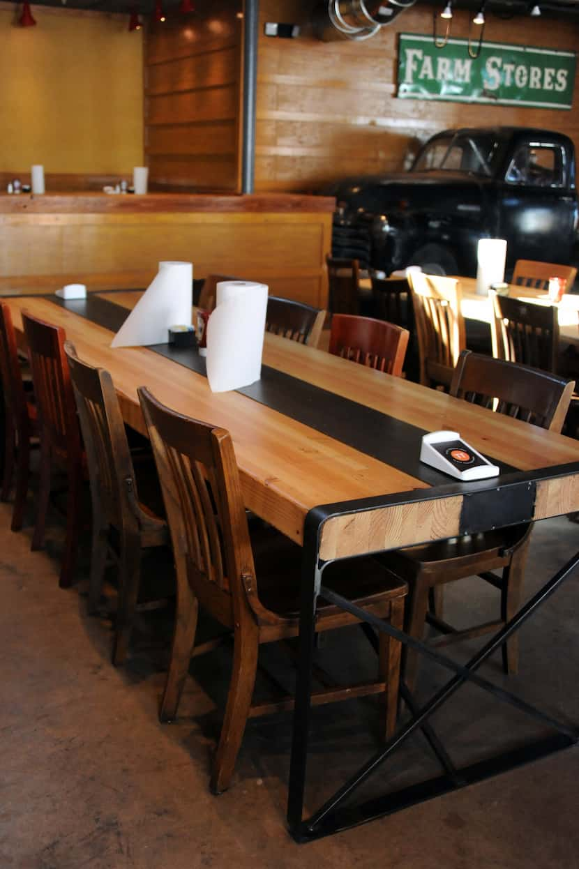 The tables are made from recycled materials at the new Ten 50 BBQ in Richardson.