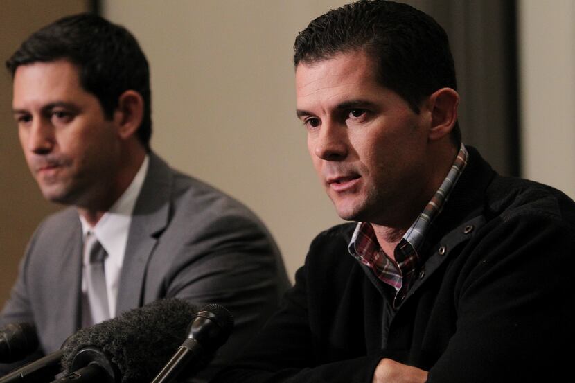 Former Texas Rangers infielder Michael Young, right, seated with representative Josh...