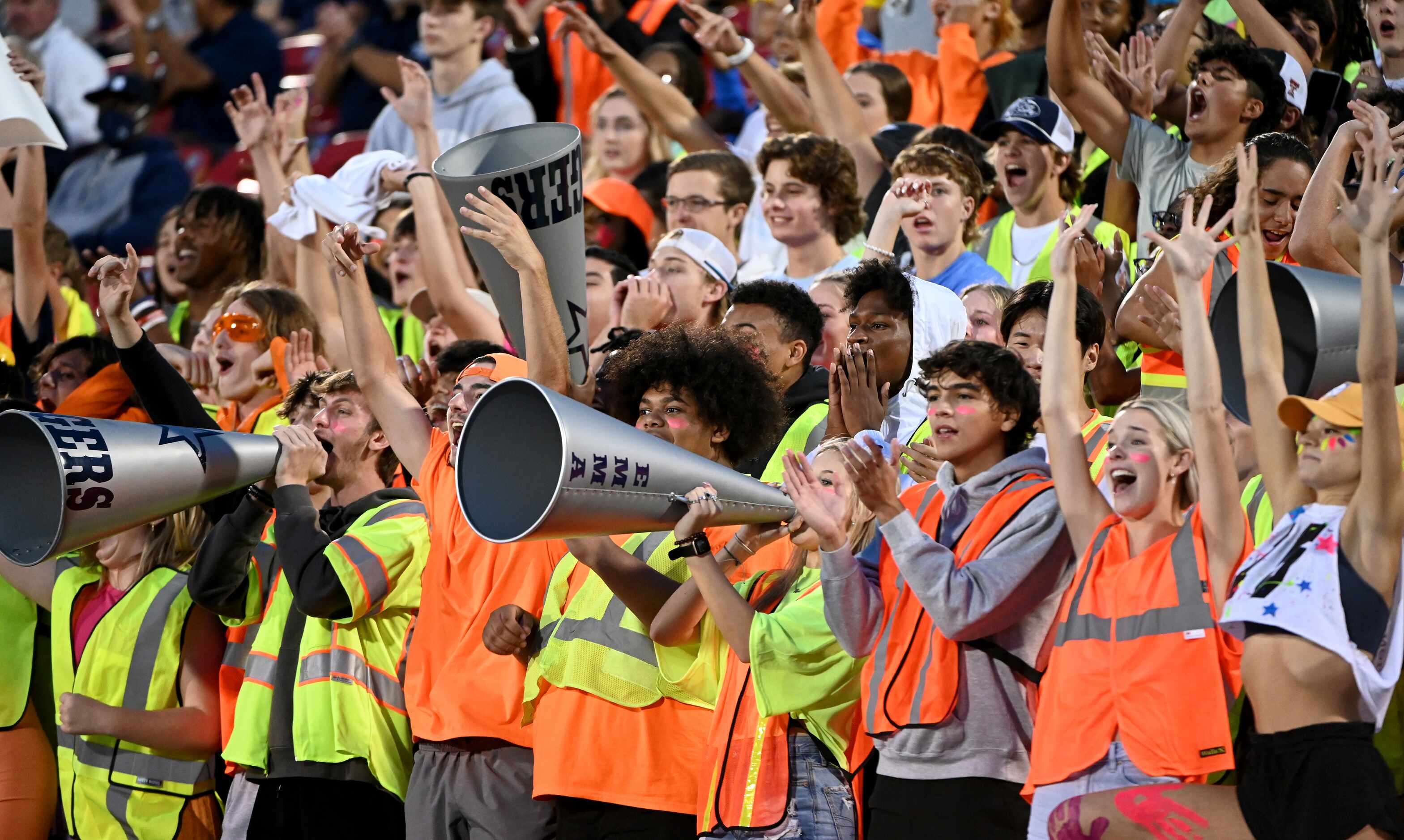 Frisco Lone Star’s students cheer in the first half of a high school football game between...