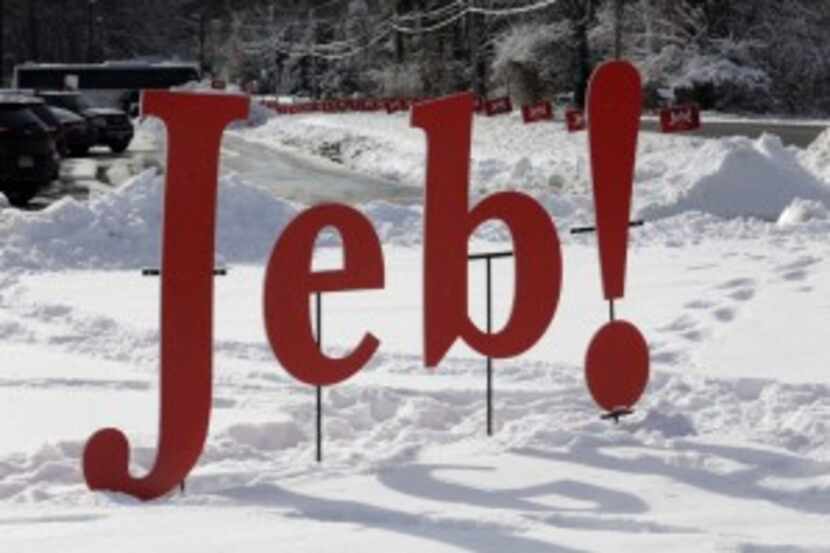  A Jeb! sign is set in a snowbank outside Jeb Bush's campaign stop Saturday in Bedford, N.H....