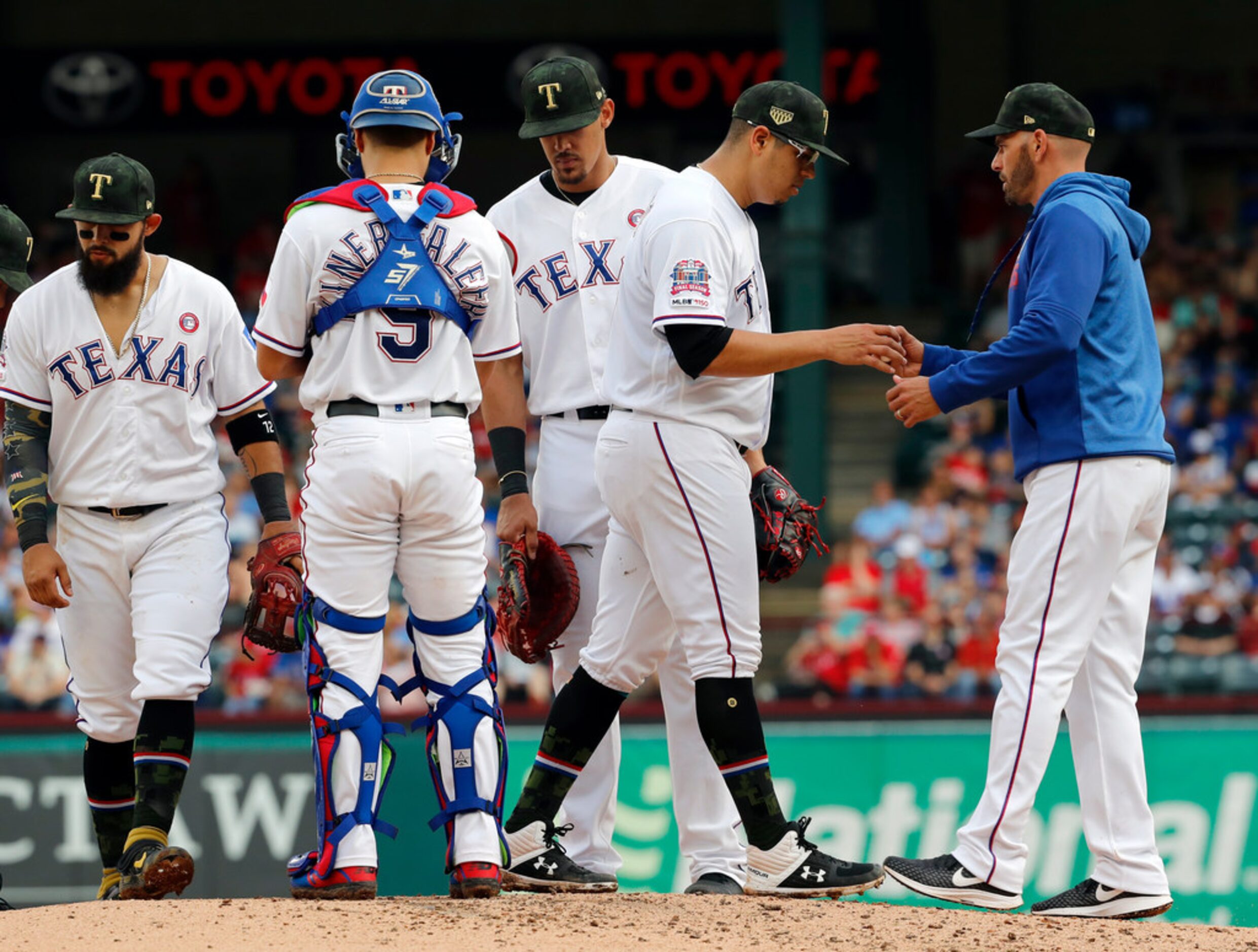 From left to right, Texas Rangers' Rougned Odor, Isiah Kiner-Falefa (9) and Ronald Guzman...