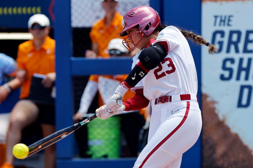 Oklahoma's Tiare Jennings hits a single against Tennessee during the first inning of an NCAA...