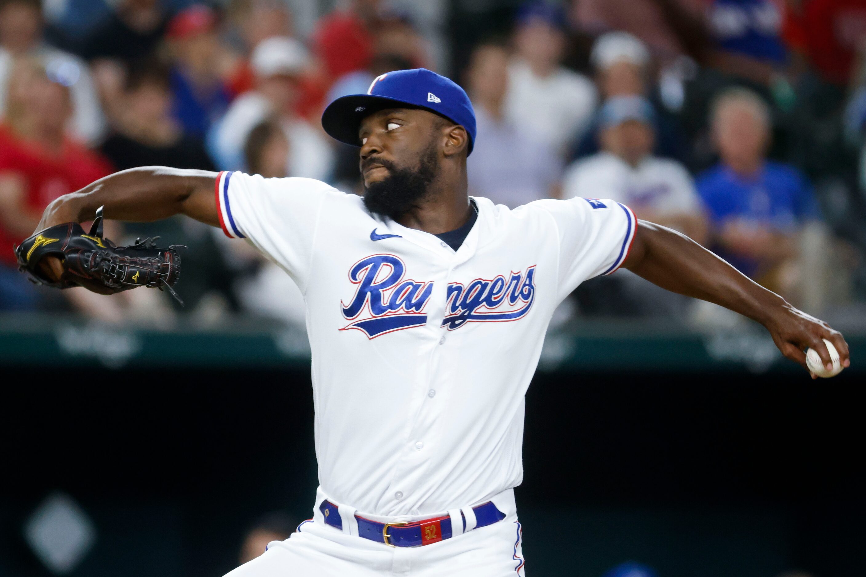 Texas Rangers relief pitcher Taylor Hearn throws during the fifth inning of a baseball game...