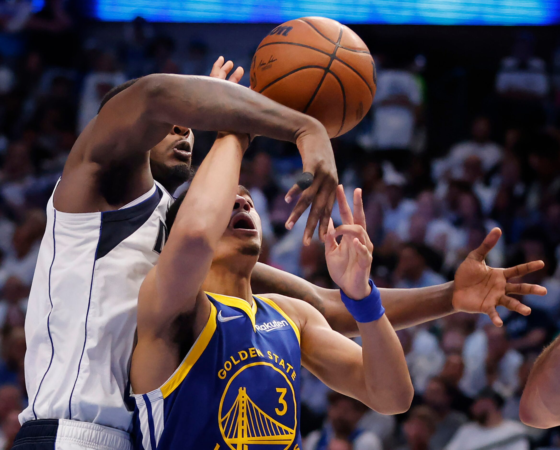 Dallas Mavericks forward Dorian Finney-Smith (10) fouls Golden State Warriors guard Jordan...