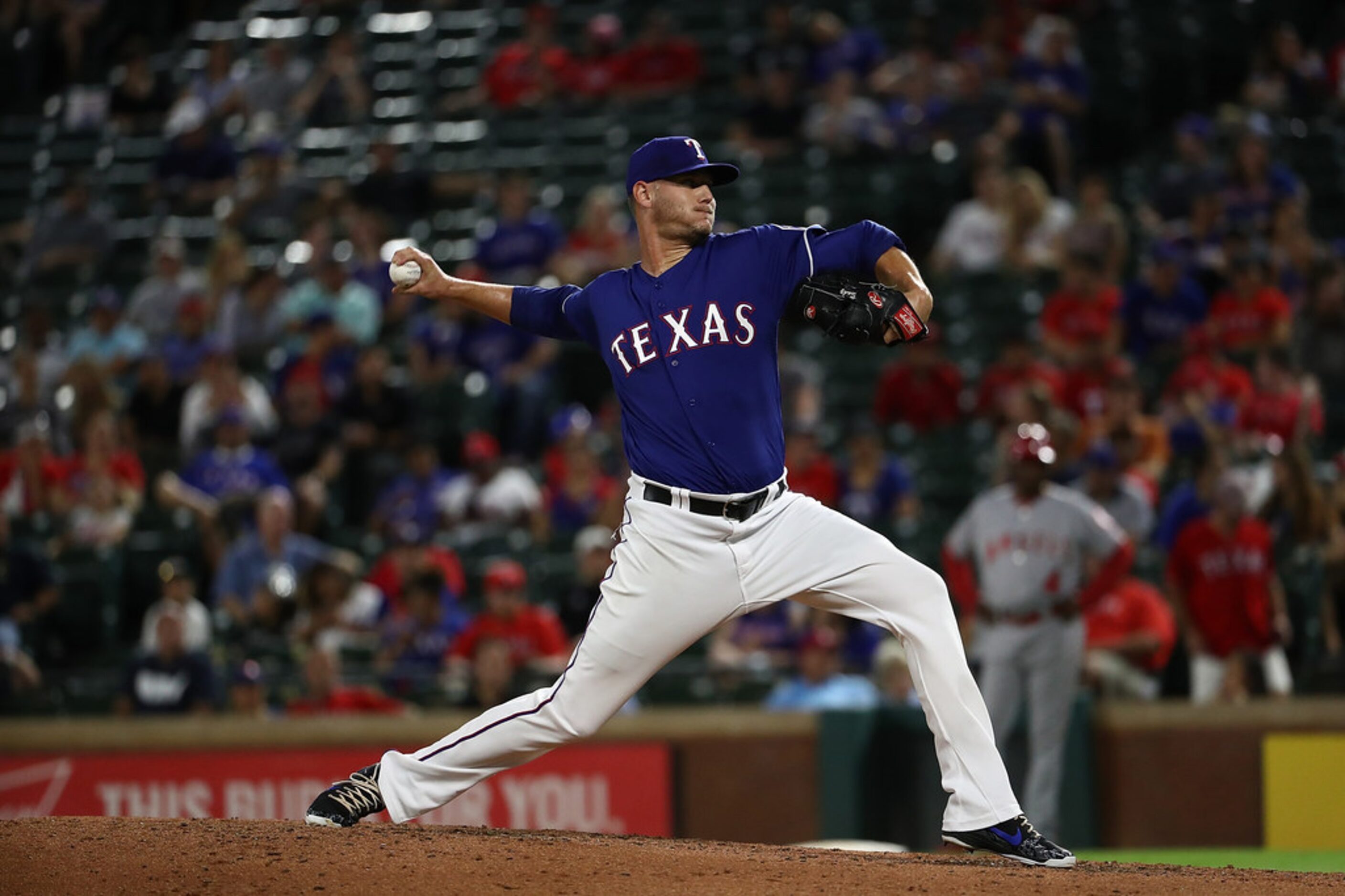 ARLINGTON, TX - SEPTEMBER 04:  Connor Sadzeck #59 of the Texas Rangers throws against the...