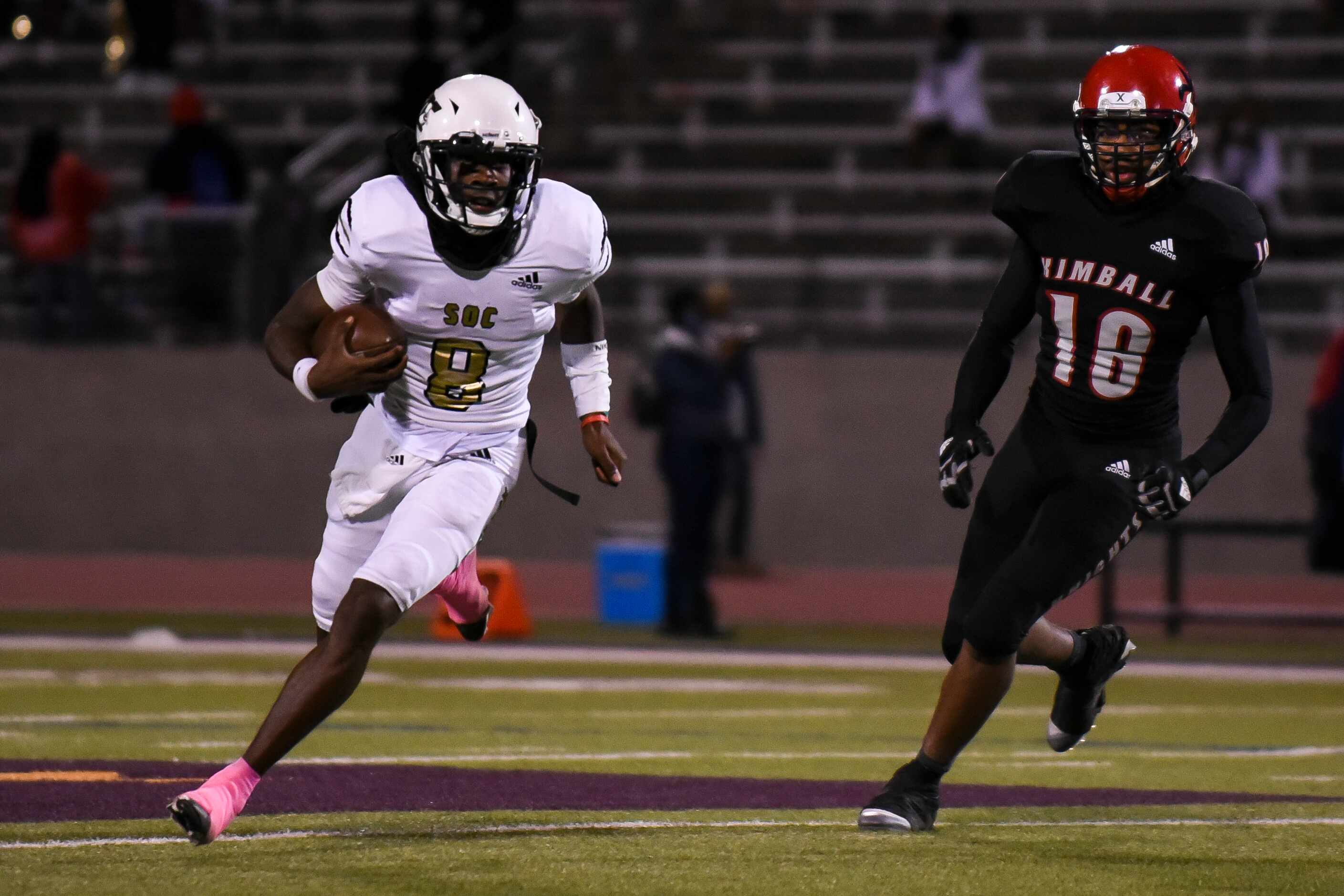 South Oak Cliff senior Kevin Henry-Jennings (8) escapes Kimball junior Terrance Mithell (18)...