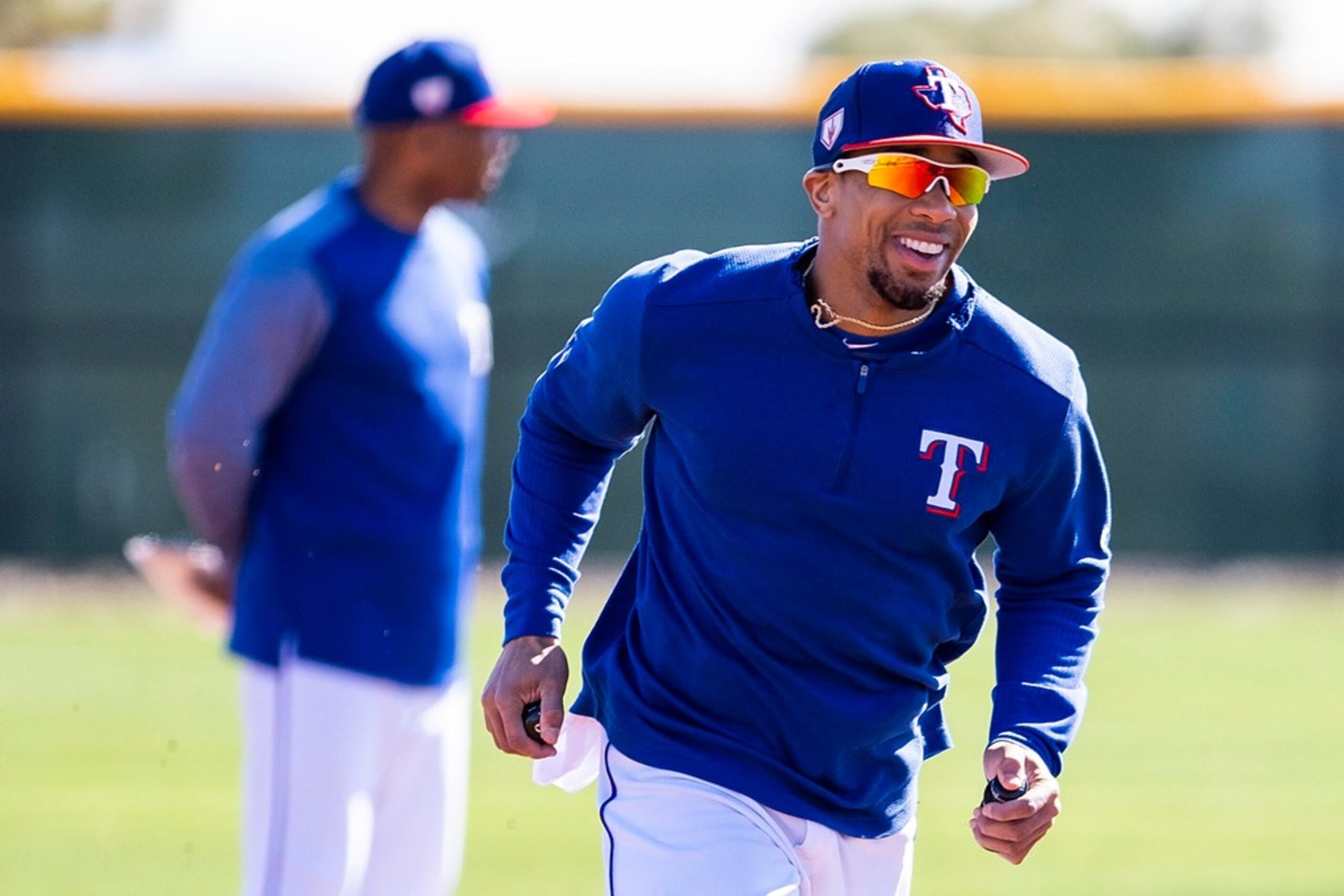 Texas Rangers outfielder Ben Revere participates in a base running drill during a spring...