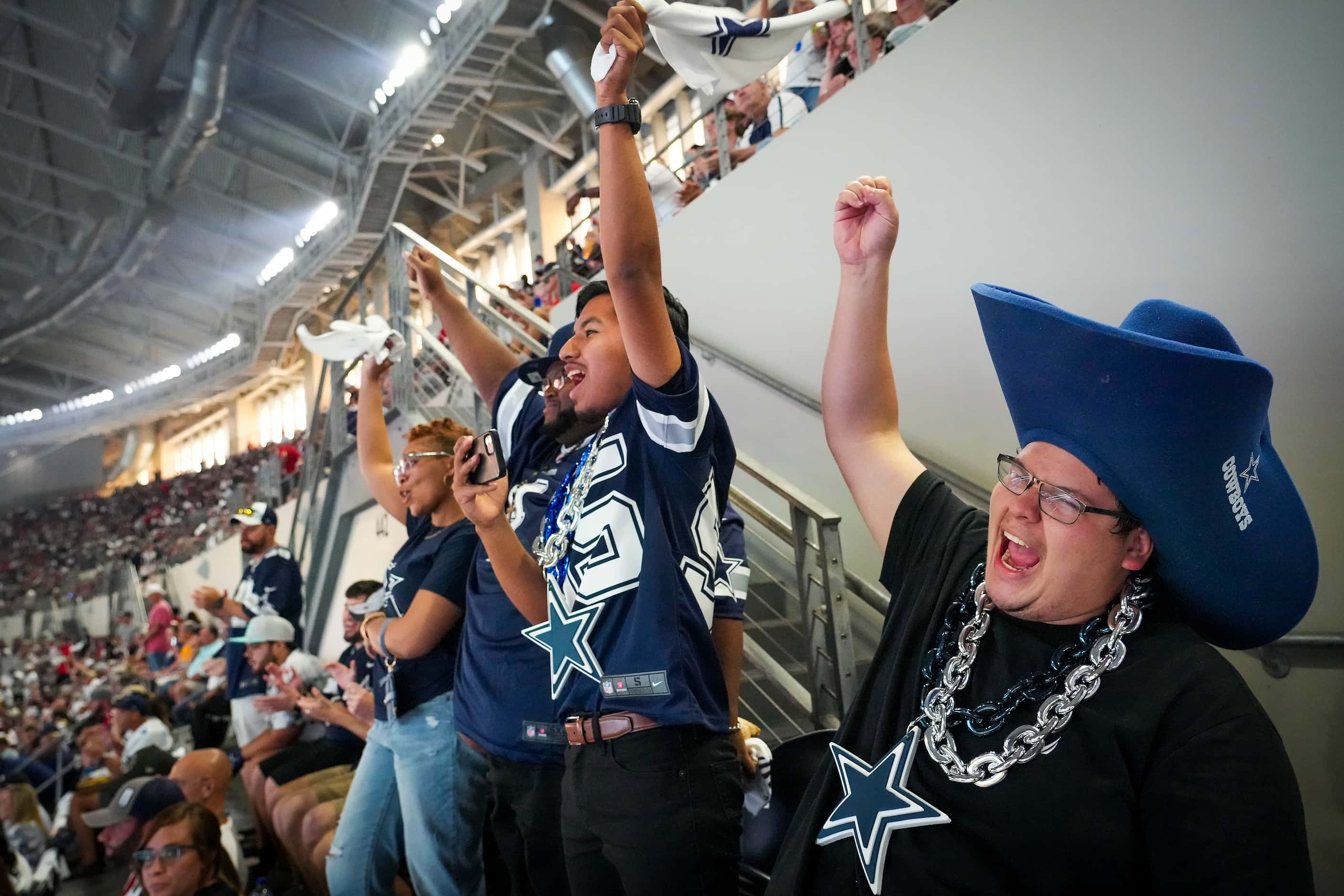 Dallas Cowboys fan Armando Perez of Coppell cheers as his team takes the field before an NFL...