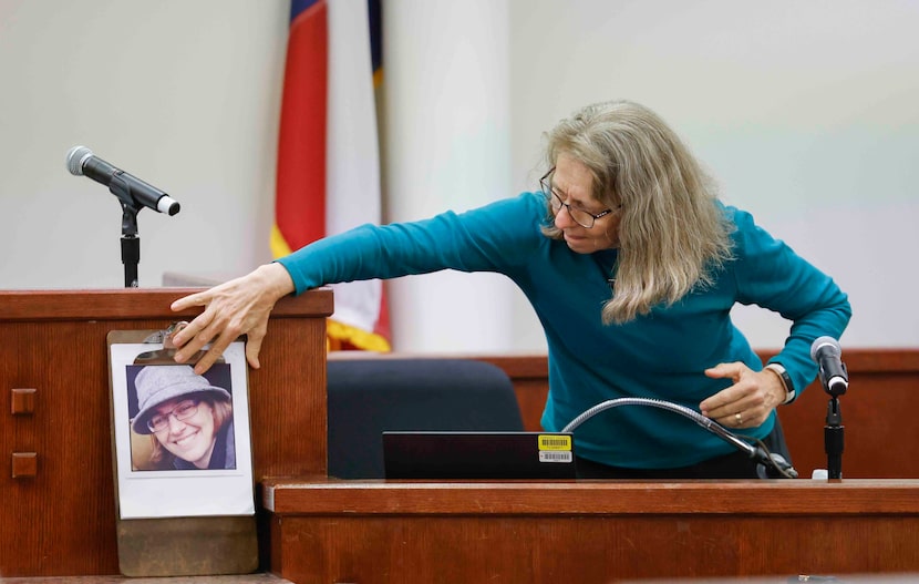 Diane Getrum touches a portrait of her slain daughter, Megan Getrum, who was murdered by...