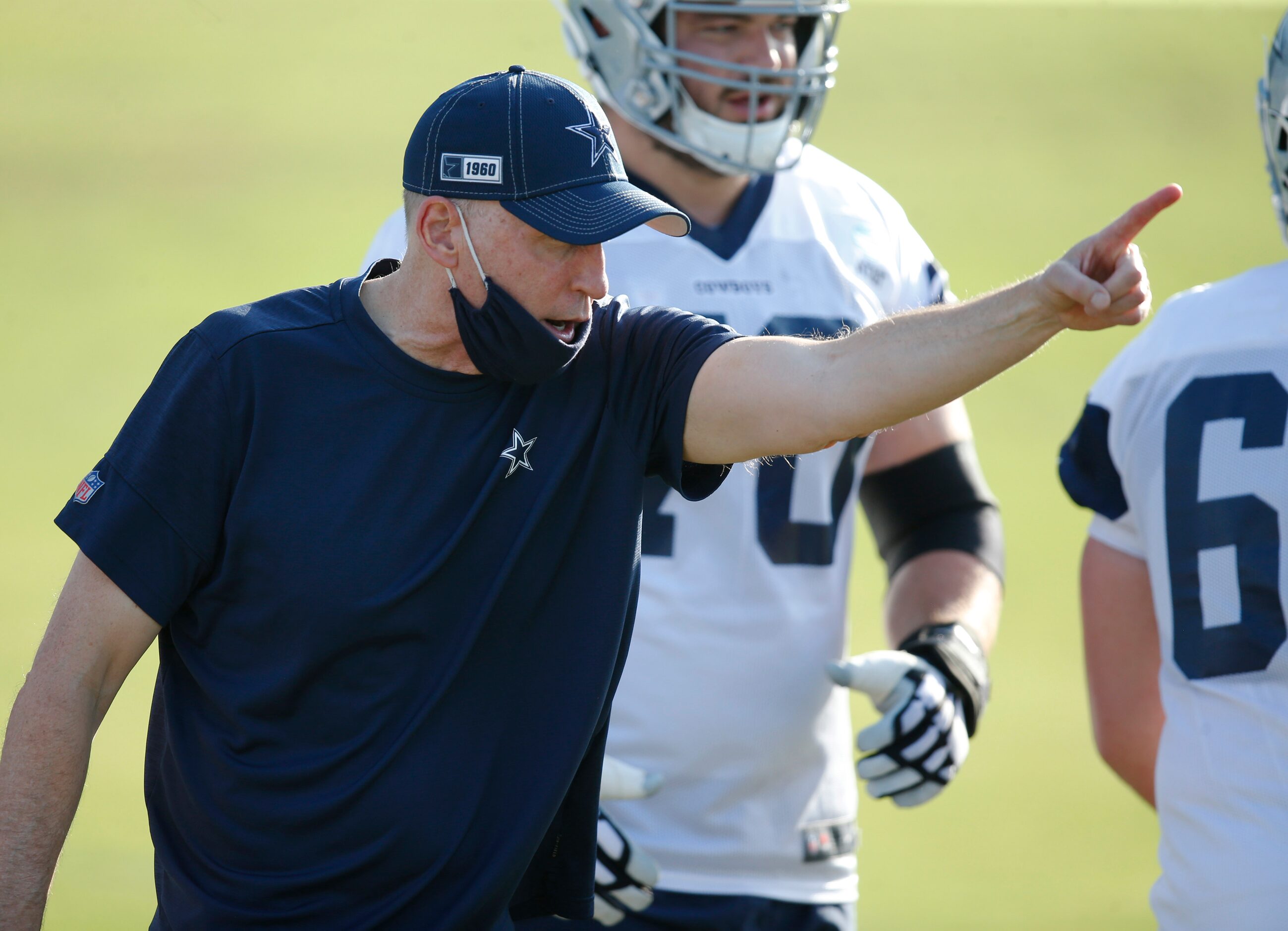 Dallas Cowboys offensive line coach Joe Philbin instructs the offensive line on a drill...