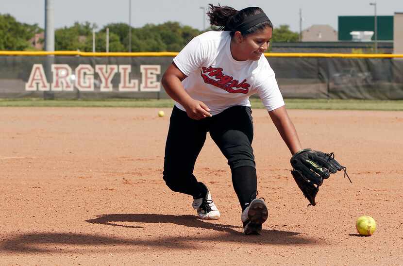 Argyle varsity shortstop Adilen Gonzalez participates in softball drills during practice at...
