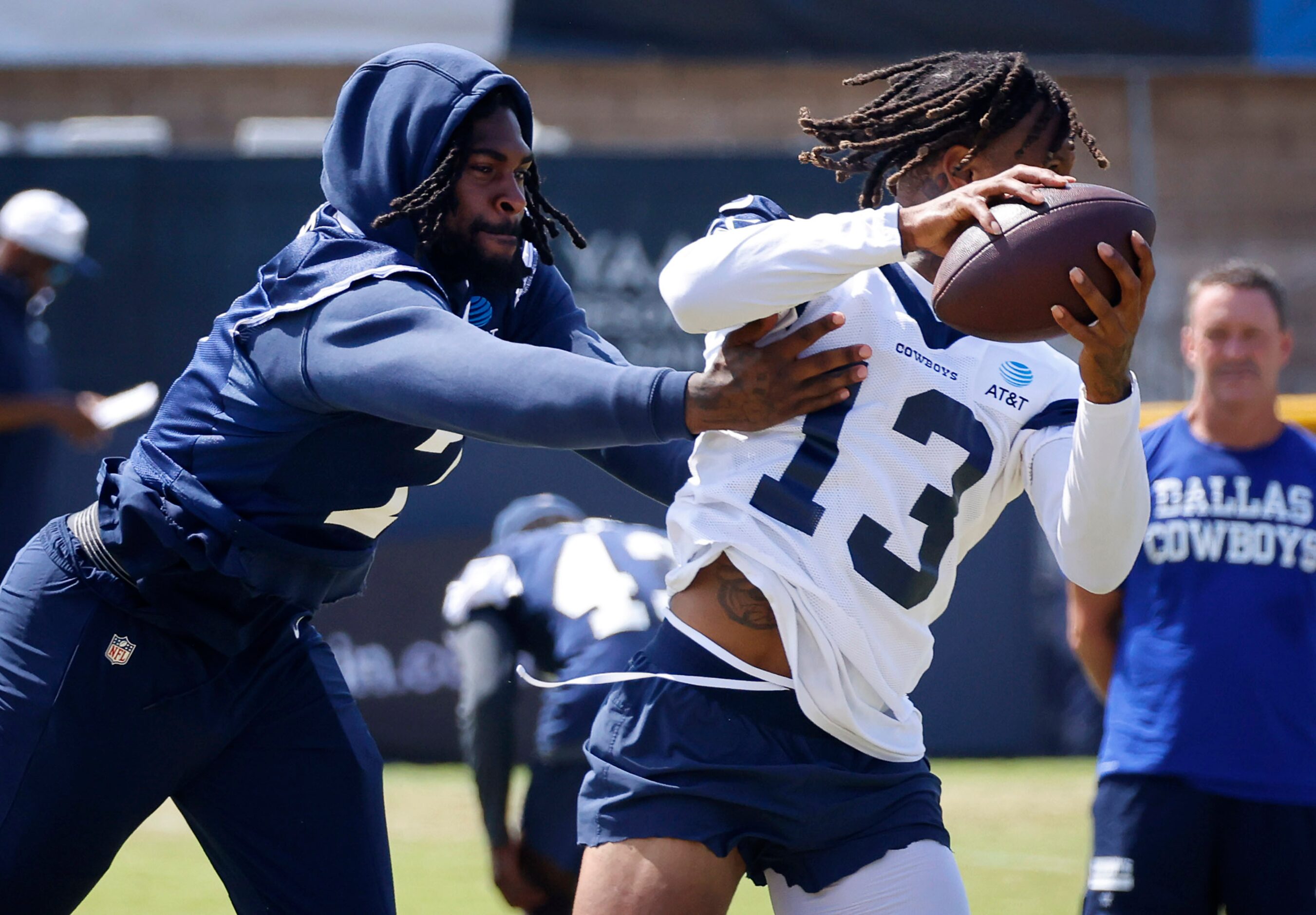 Dallas Cowboys cornerback Trevon Diggs (7) gives a shove to wide receiver Tyron...