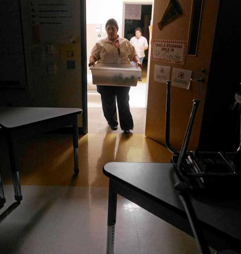 
Anna Hernandez (foreground) and Zenada Estrada deliver Breakfast in the Classroom...