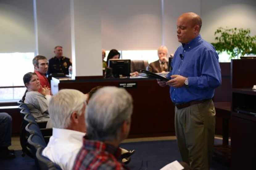 Rockwall Mayor David Sweet honors area students before a city council meeting on March 17 in...