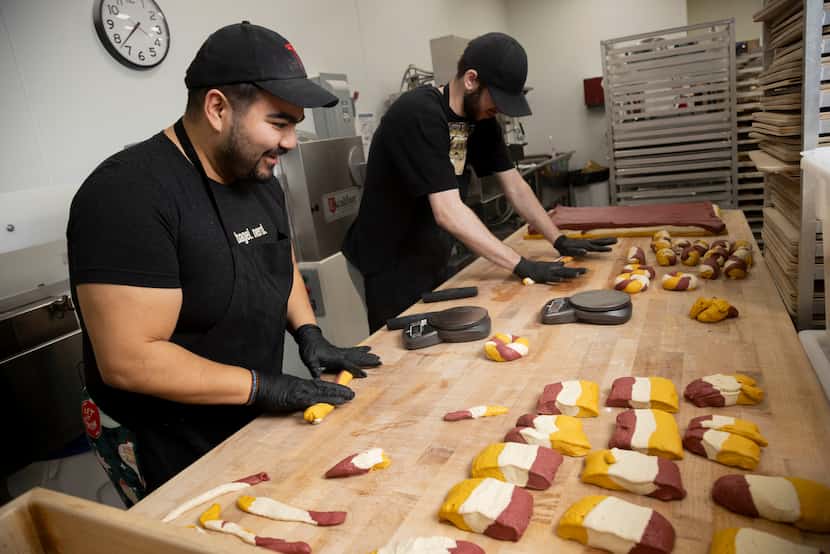 (From left) Baker Leo Quintana and lead baker Ethan Grant roll dough for San Francisco 49ers...
