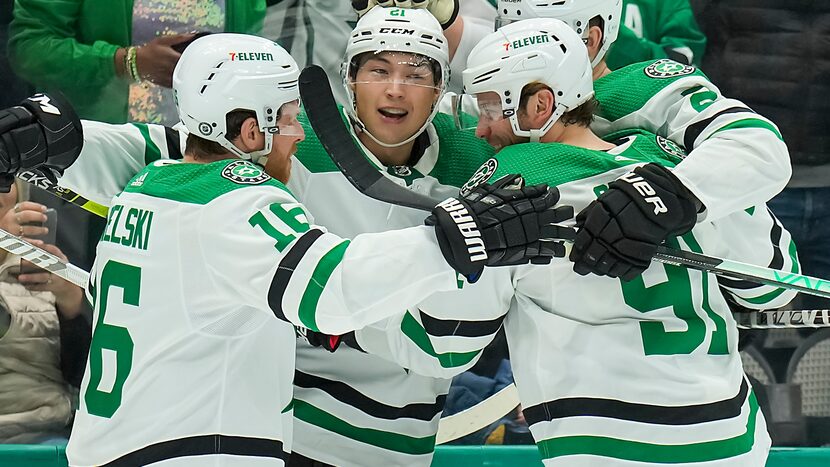 Dallas Stars left wing Jason Robertson (21) celebrates with center Joe Pavelski (16), center...