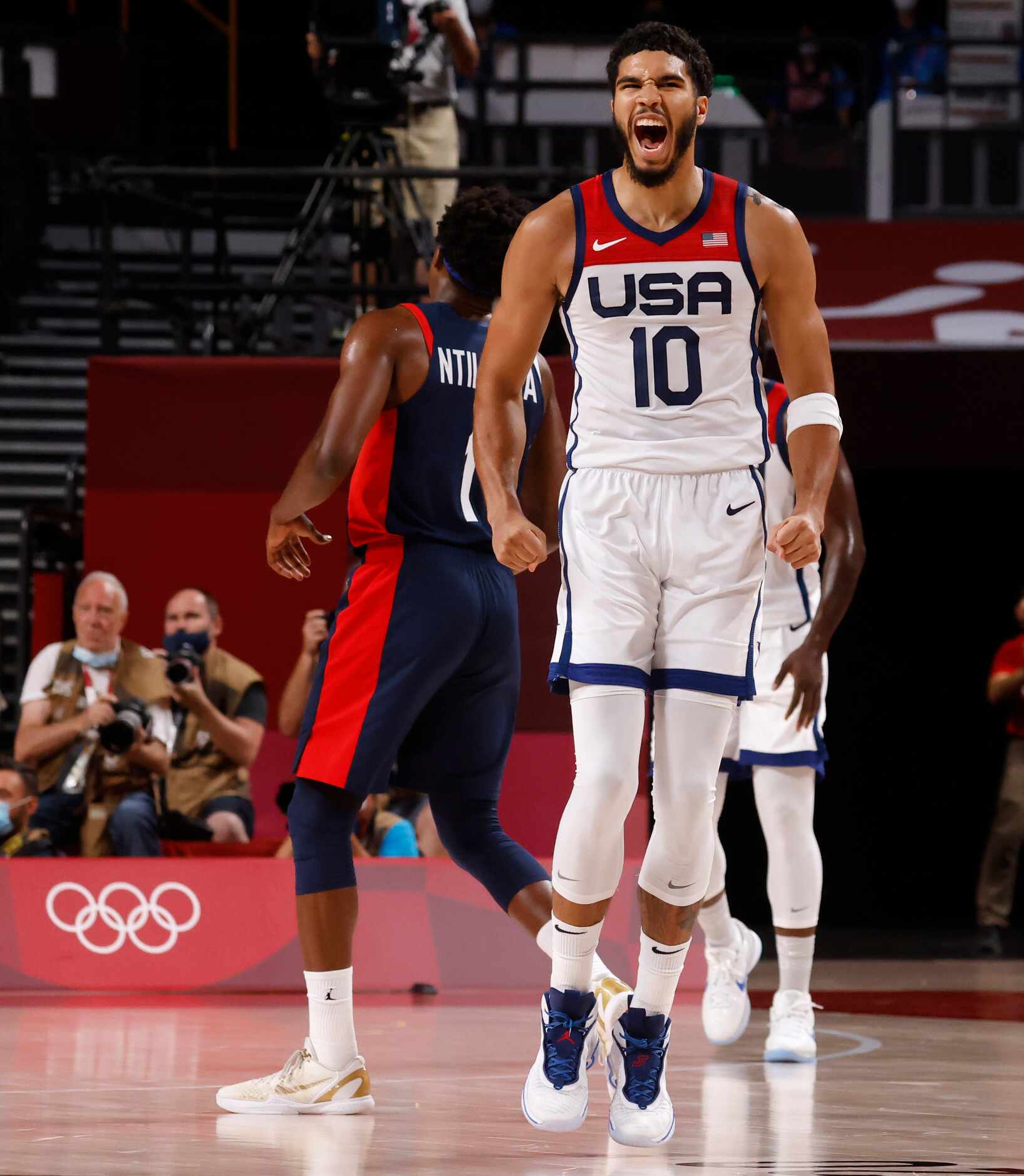 USA’s Jayson Tatum (10) celebrates after hitting a three pointer in a game against France...