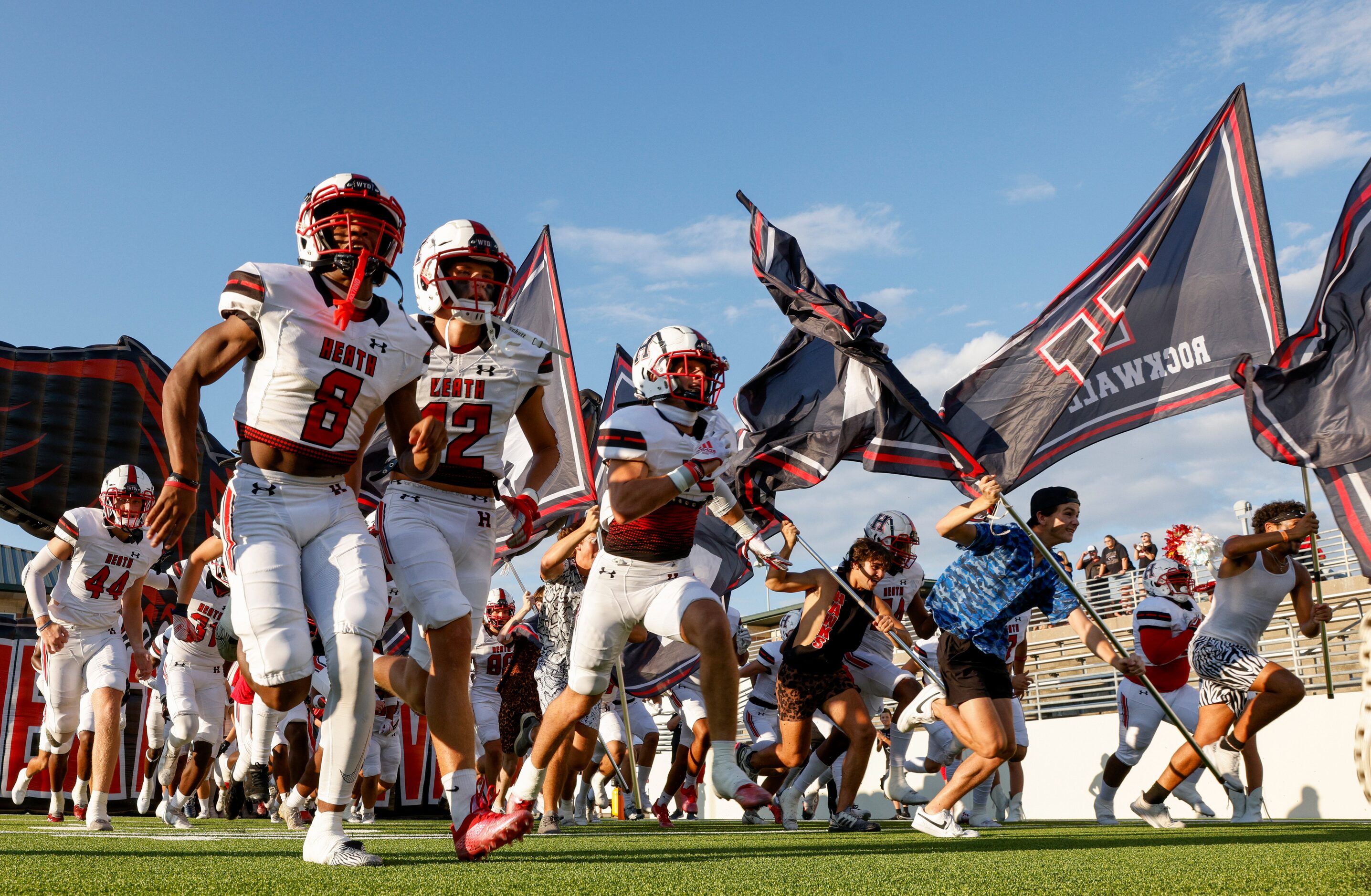 Rockwall-Heath takes the field before the first game of the season against Denton Guyer at...