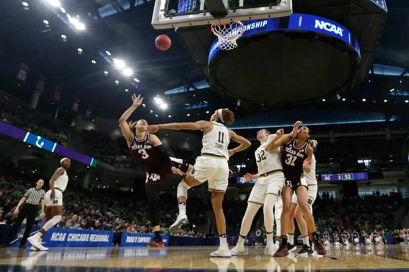 Texas A&M's Chennedy Carter (3) shoots against Notre Dame's Brianna Turner (11) during the...
