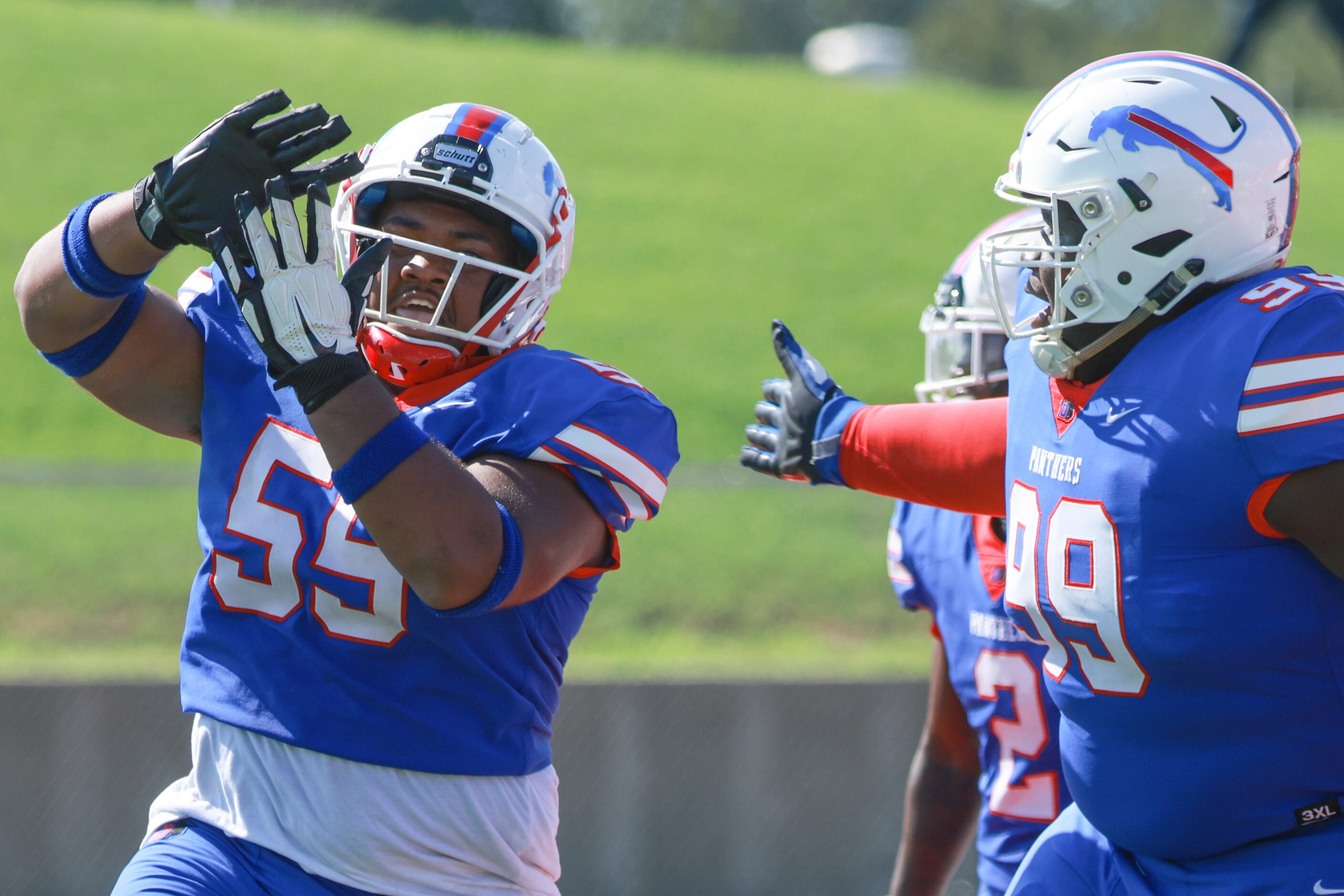 Duncanville High School Jabreohn Peters (55) throws his hands up like he’s throwing money...