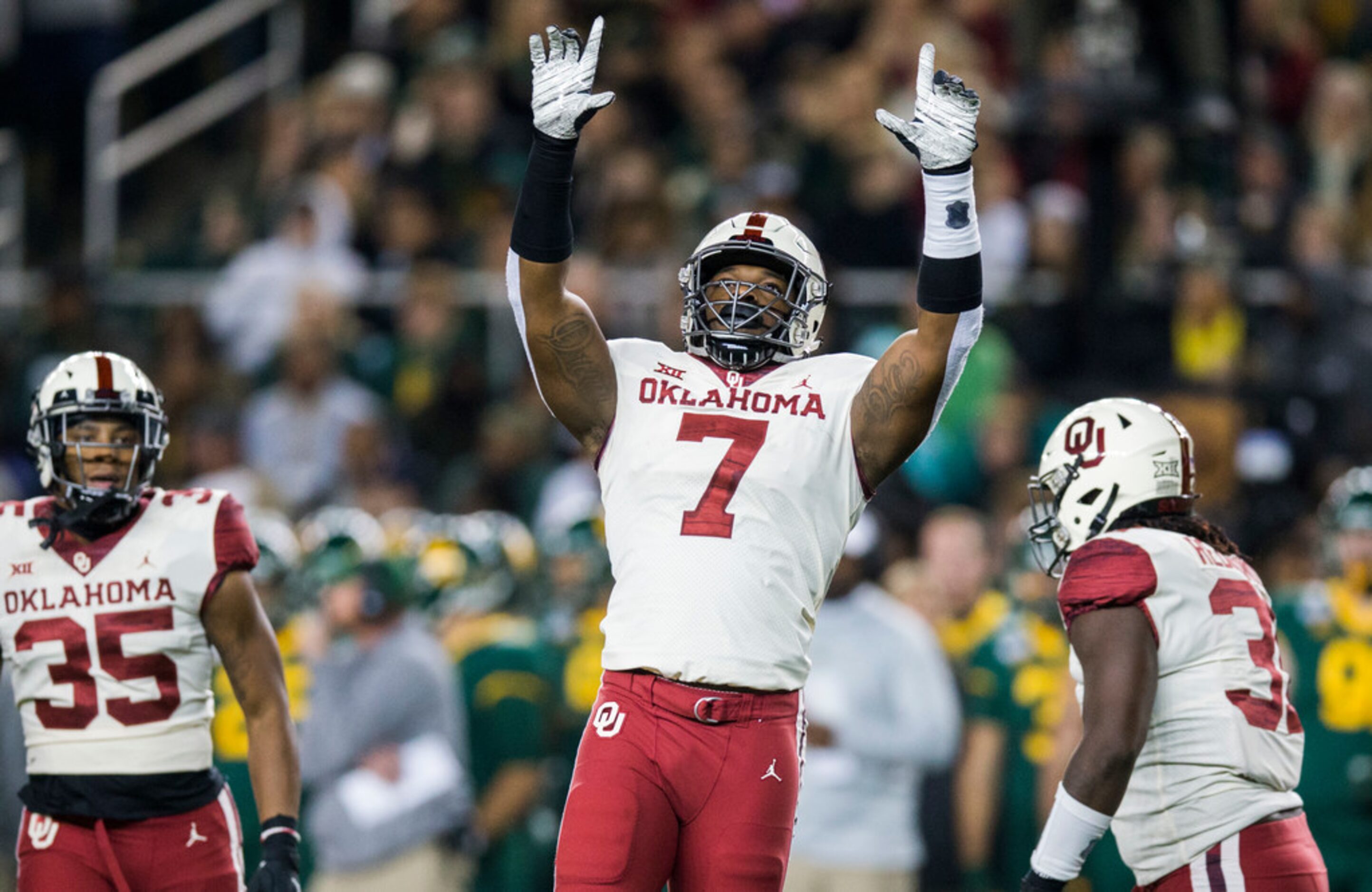 Oklahoma Sooners defensive lineman Ronnie Perkins (7) celebrates a sack during the first...