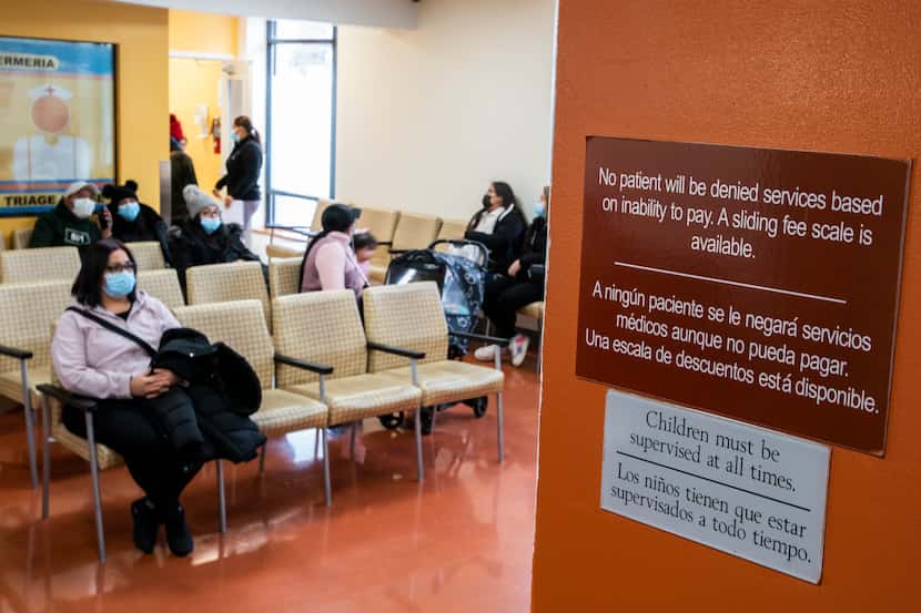 People wait for treatment at the Plaza Del Sol Family Health Center in the Queens borough in...