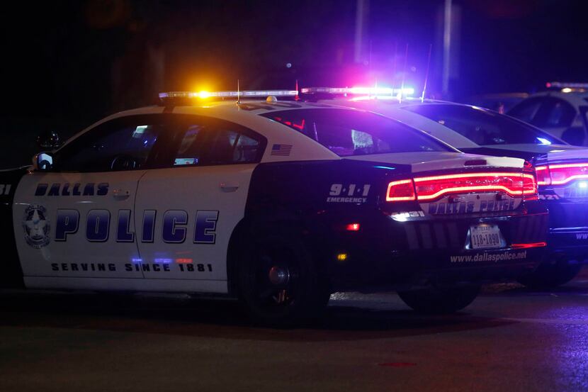 Dallas Police department at the scene of a shooting where a 13-year-old boy died after being...
