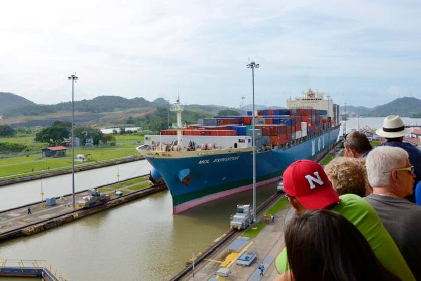 
Spectators watching a ship passing through the Miraflores Locks of the Panama Canal, Panama.

