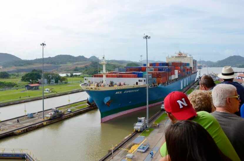 
Spectators watching a ship passing through the Miraflores Locks of the Panama Canal, Panama.
