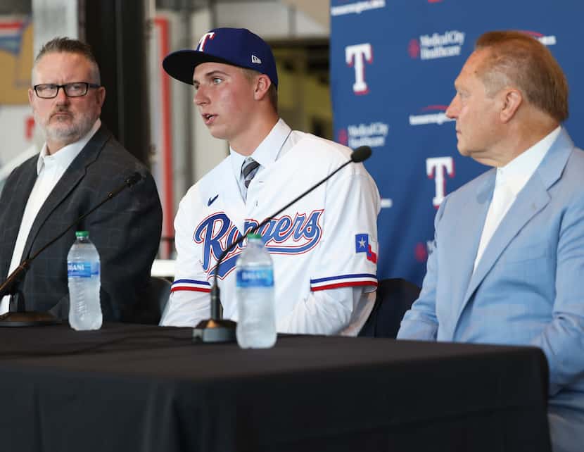 Brock Porter, Texas Rangers fourth-round draft pick, answers media questions while sitting...