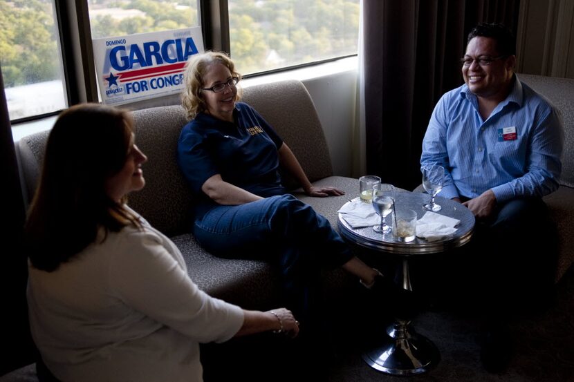 Campaign fundraising manager Michelle Love (left), party guest Ellen Touchstone and Omar...