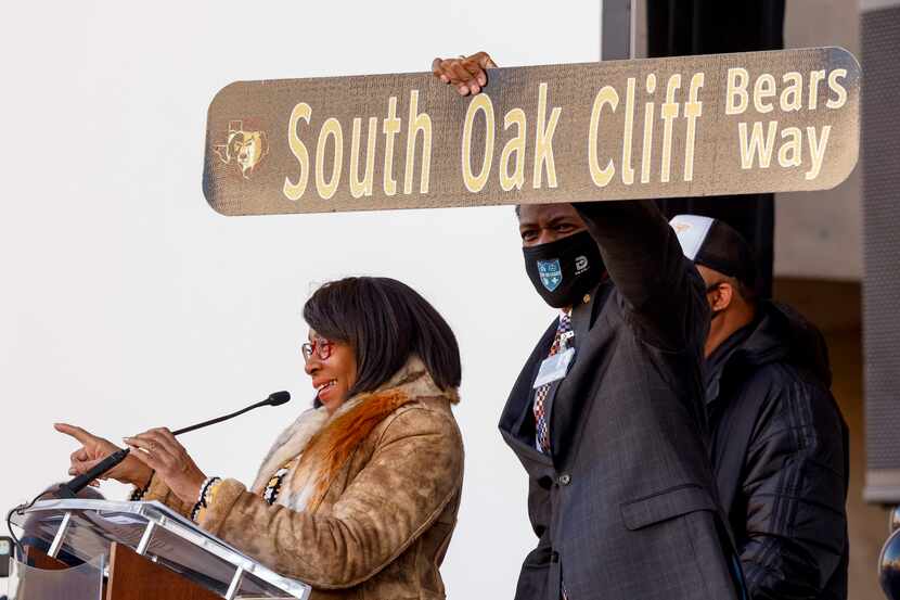 Dallas City Council member Carolyn King Arnold unveils a street sign during a ceremony...