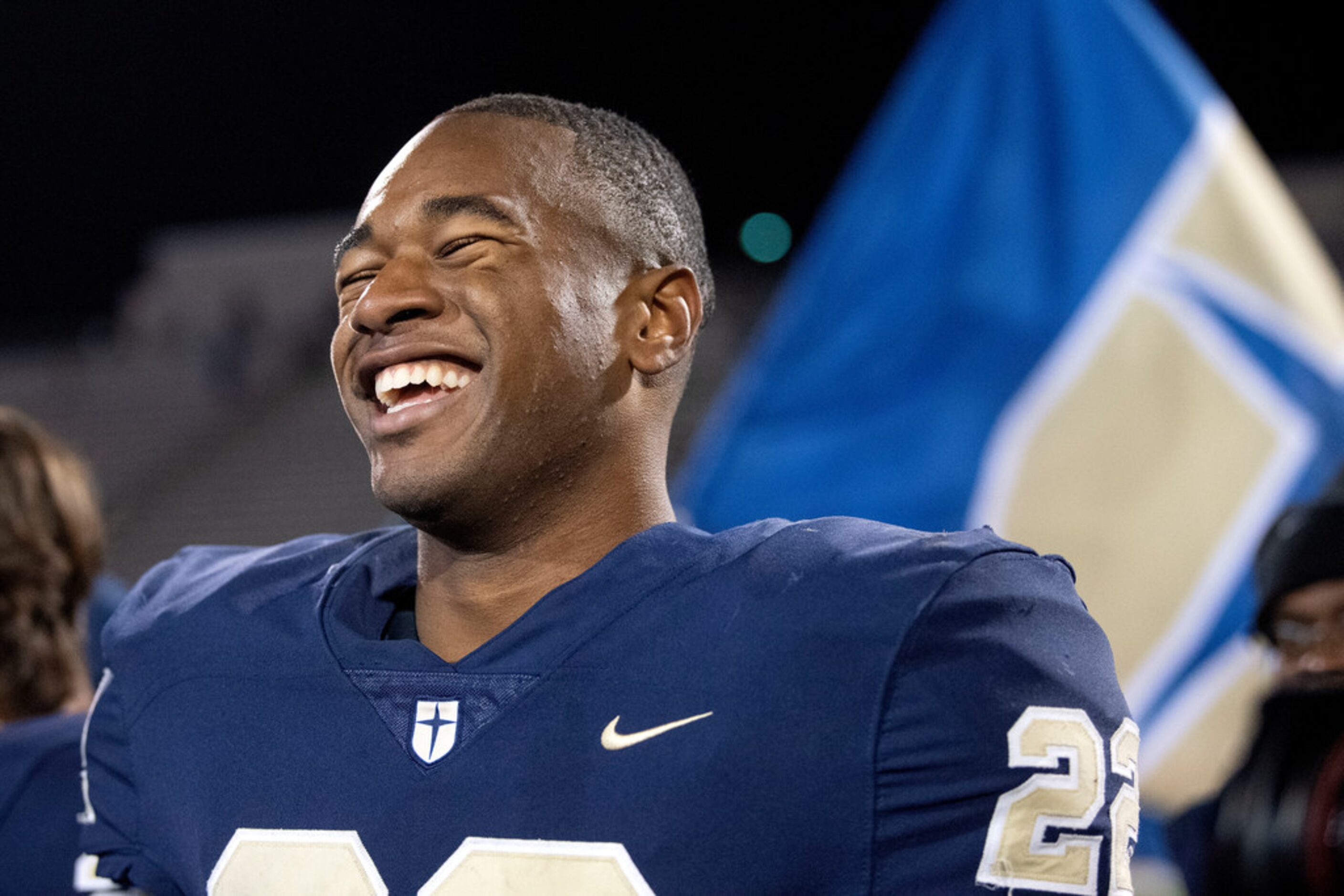 Jesuit senior running back E.J. Smith (22) smiles after his team's 27-25 victory over...