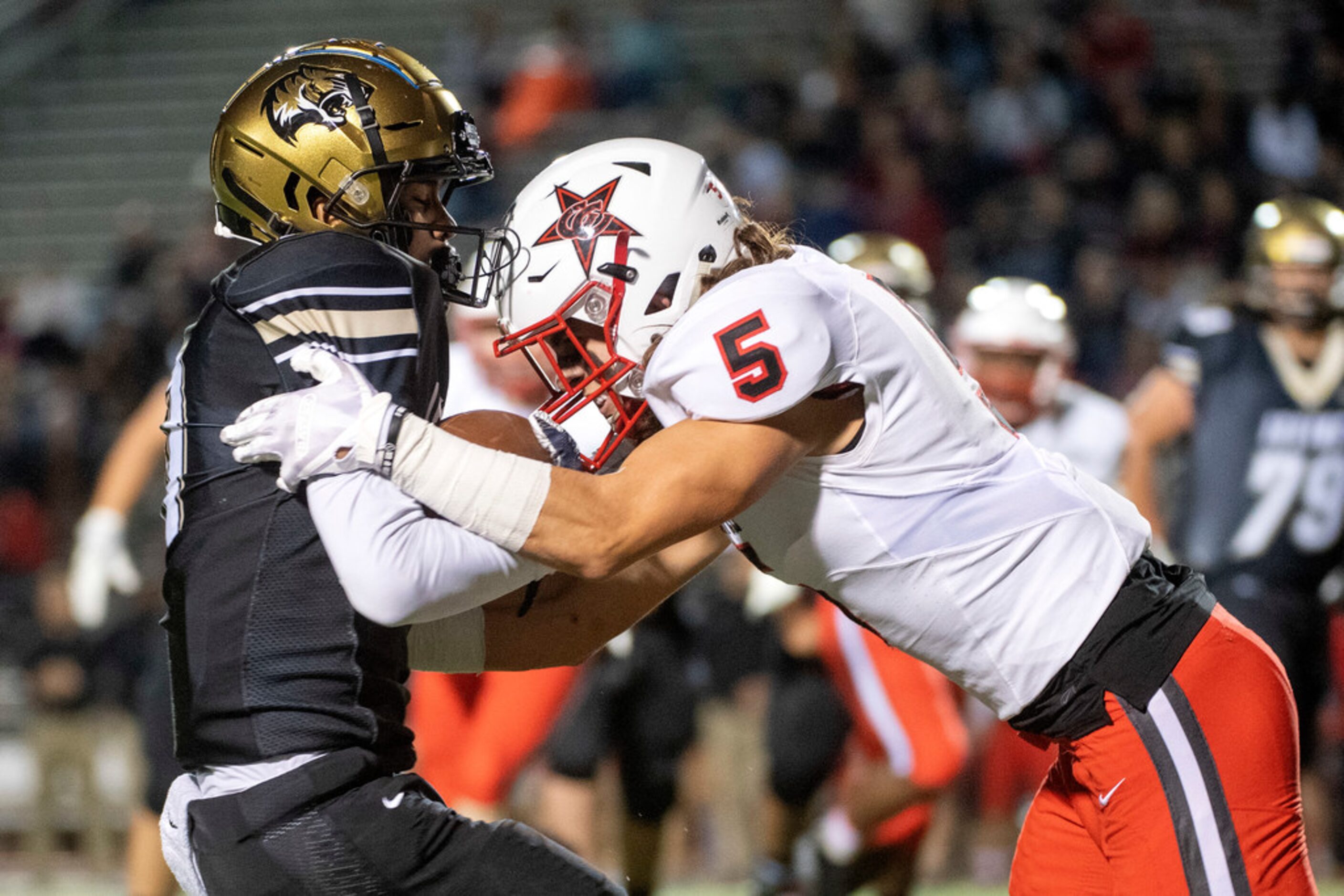 Coppell senior defensive back Justin Mrray (5) hits Irving sophomore wide receiver Shane...