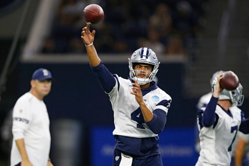 Dallas Cowboys quarterback Dak Prescott (4) makes a throw during practice at Dallas Cowboys...