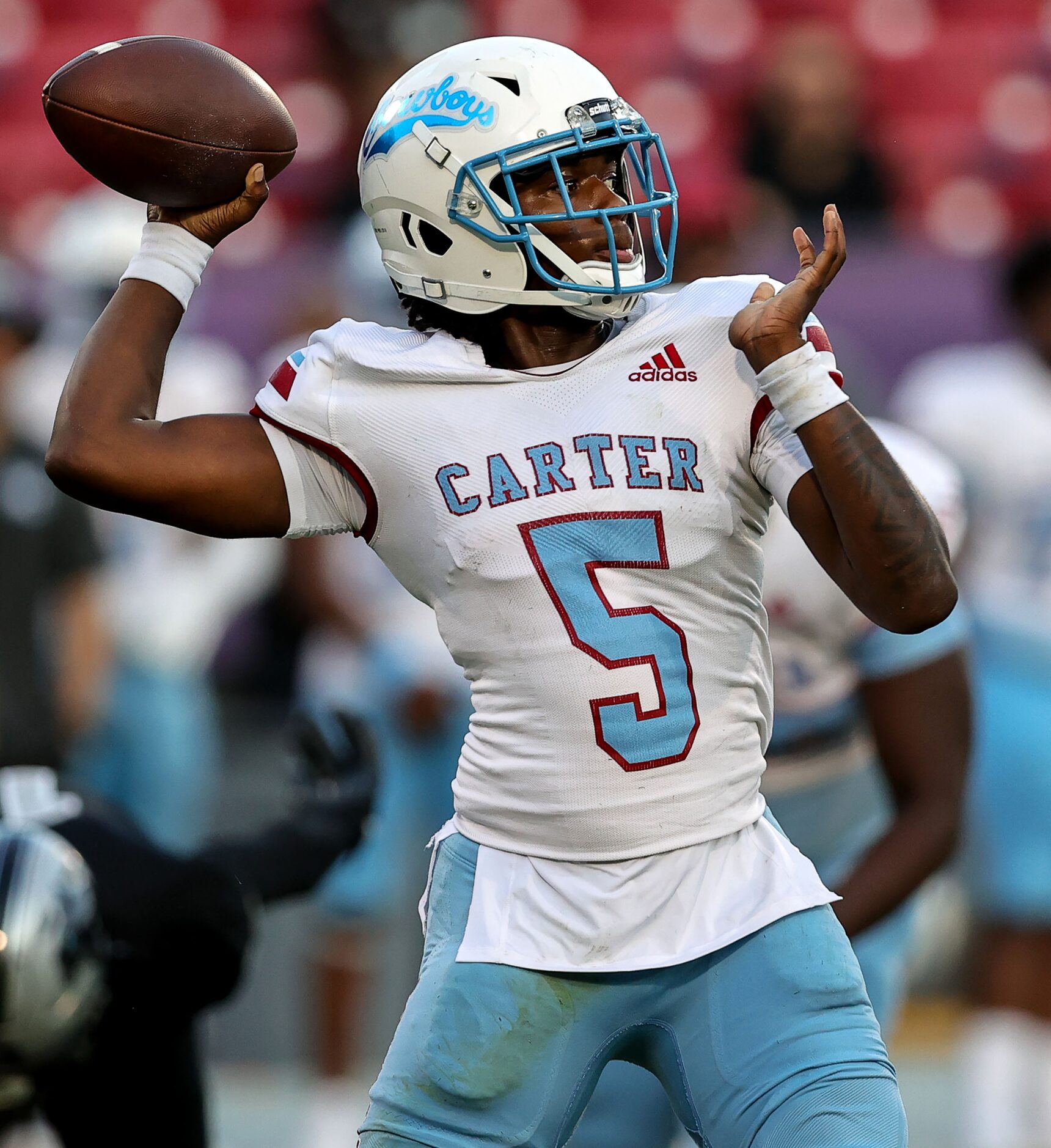 Dallas Carter quarterback Christopher Miller (5) attempts a pass against Frisco Panther...