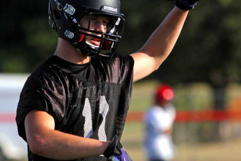 Defensive back Connor Wilson holds up the ball during the Argyle Eagles first football...