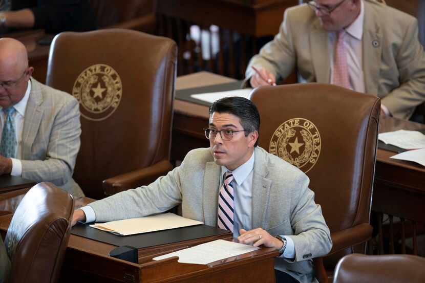 State Rep. Chris Paddie, R-Marshall, sits at his desk in the Texas House in May 2021. Paddie...