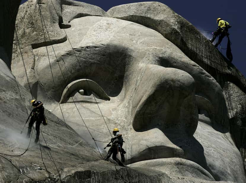 German workers Gerhard Buchar, right, and Winfried Hagenau, left, along with National Park...