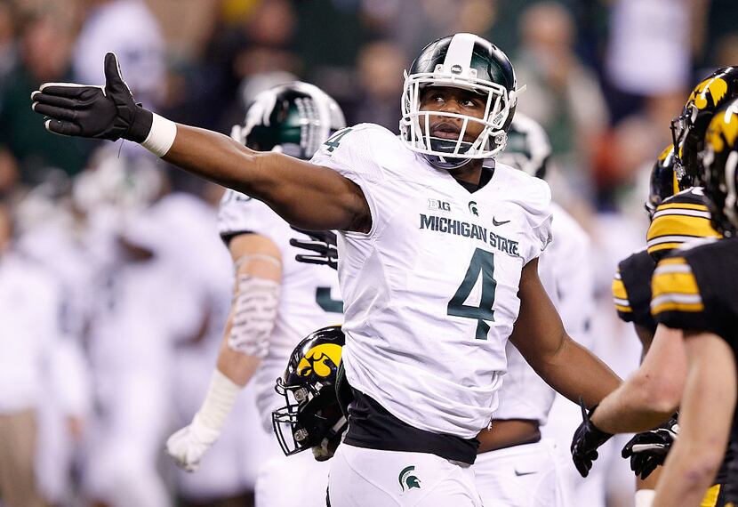 INDIANAPOLIS, IN - DECEMBER 05:  Malik McDowell #4 of the Michigan State Spartans reacts...
