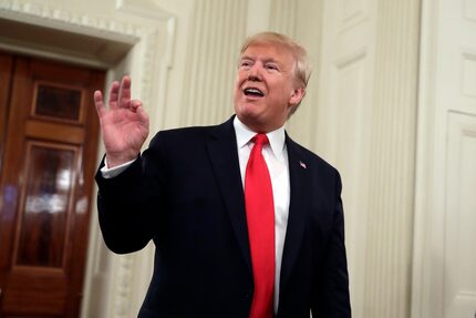 President Donald Trump talks to the media during the NCAA Collegiate National Champions Day...